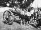 Thailand: Boys with a giant drum in a festival procession to Wat Phra That Haripunchai, Lamphun (c. 1920)